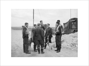 Spitfire pilots of No. 19 Squadron RAF gather at Manor Farm, Fowlmere, near Duxford in Cambridgeshire, September 1940.