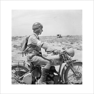 Western Desert:  An Army despatch rider on his machine in the desert