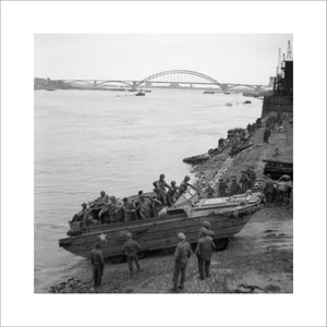 A British DUKW carries supplies and American paratroopers across the Waal river at Nijmegen, 30 September 1944.