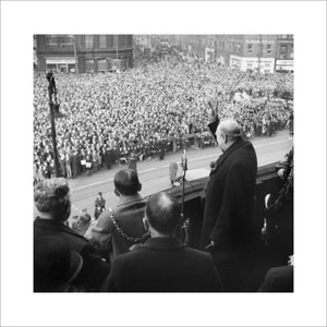 Winston Churchill gives his famous 'V for Victory' sign while addressing crowds from the balcony of City Hall in Sheffield, during a tour of the Midlands and North of England, November 1941.