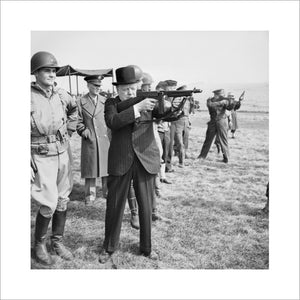 Winston Churchill fires a Thompson submachine gun alongside the Allied Supreme Commander, General Dwight D Eisenhower, during an inspection of US invasion forces, March 1944.