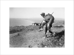 An Australian carrying his wounded mate to a medical aid post for treatment, Gallipoli, 1915.