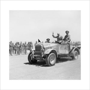 Winston Churchill giving his famous V-for-Victory sign while being driven past a line of troops in Tel-el-Kebir, 9 August 1942.