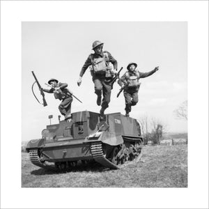 Troops of the 2nd Monmouthshire Regiment leap from their Universal carrier during an exercise near Newry in Northern Ireland, 26 April 1941.