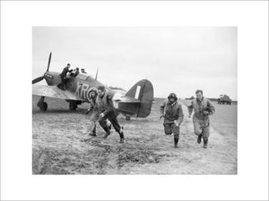 American pilots of No 71 'Eagle' Squadron rush to their Hawker Hurricanes at Kirton-in-Lindsey, 17 March 1941.
