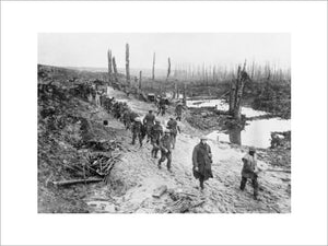British troops of the 17th Battalion, London Regiment, 47th Division, crossing a muddy area in the Ancre Valley, Somme, October 1916.