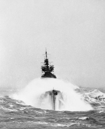 The battleship HMS DUKE OF YORK in heavy seas on a convoy escort operation to Russia, March 1942.