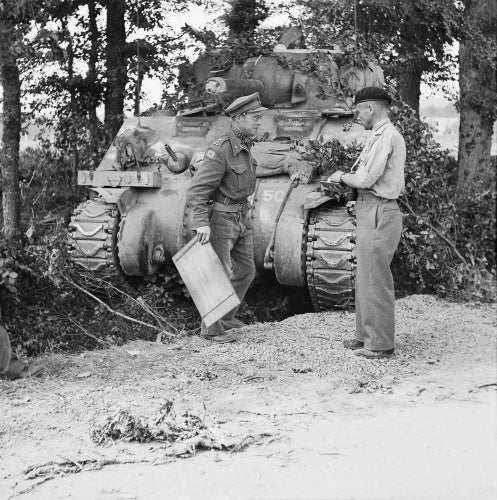 Major General George 'Pip' Roberts (right), commanding 11th Armoured Division, with Brigadier Roscoe Harvey of 29th Armoured Brigade, and a Sherman command tank, Normandy, 15 August 1944.