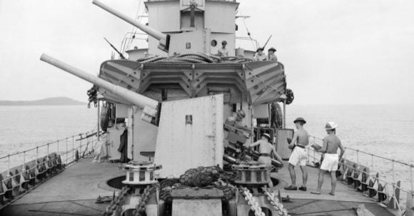 The forward 4.7-inch guns of HMS FOXHOUND, off Freetown, Sierra Leone, August 1943.