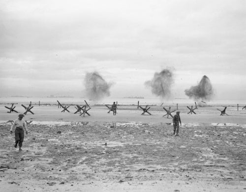 Royal Navy personnel of an ostacle clearance unit blowing up German beach obstacles at La Riviere, Normandy, 9 June 1944.