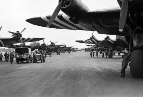 Short Stirling Mk IVs of Nos. 196 and 299 Squadrons RAF lining the runway at Keevil in Wiltshire, before emplaning paratroops of the 5th Parachute Brigade Group for the invasion of Normandy, 5 June 1944.