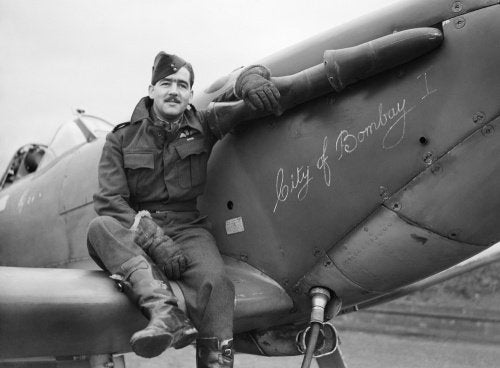 Squadron Leader H J L Hallowes, CO of No. 122 Squadron, with his Supermarine Spitfire Mk V at Scorton in Yorkshire, December 1941.
