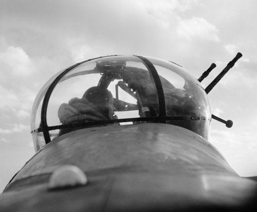 A No. 57 Squadron Lancaster mid-upper gunner in his turret, February 1943.