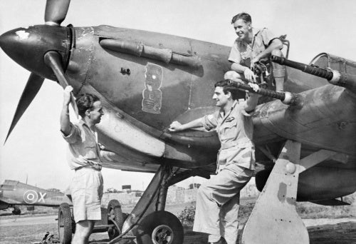 Pilots discuss a sortie by the nose of a Hawker Hurricane Mk IIC of No. 224 Group RAF in north-eastern India, 1943.
