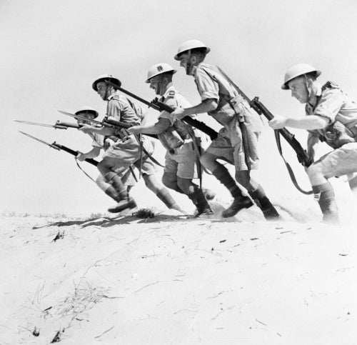 Men of the 51st Highland Division charging with fixed bayonets during a training exercise in the desert, North Africa, 23 September 1942.