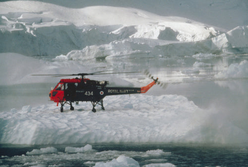 A Wasp helicopter from the Ice Patrol Ship HMS ENDURANCE touches down on pack ice during a survey operation in the Antarctic, 1980.