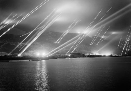 Searchlights pierce the night sky during an air-raid practice on Gibraltar, 20 November 1942.