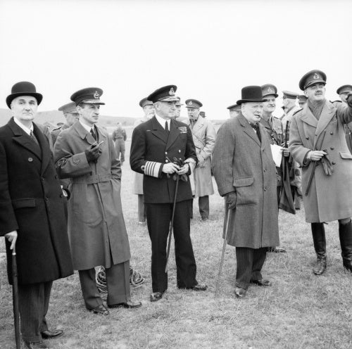 Winston Churchill with his scientific advisor Lord Cherwell (extreme left), Air Chief Marshal Sir Charles Portal and Admiral of the Fleet Sir Dudley Pound, watching a display of anti-aircraft gunnery, June 1941.