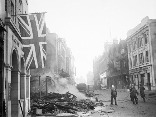 A Union Flag hangs defiantly from a building in the aftermath of the air raid which devastated the centre of Coventry on the night of 14/15 November 1940.