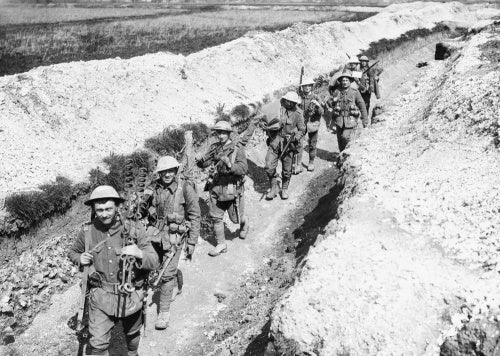 Men of the King's Liverpool Regiment carrying barbed wire picket posts along a communication trench near Blairville Wood, 16th April 1916.