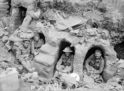Men of the Border Regiment resting in shallow dugouts near Thiepval Wood, Somme, August 1916.