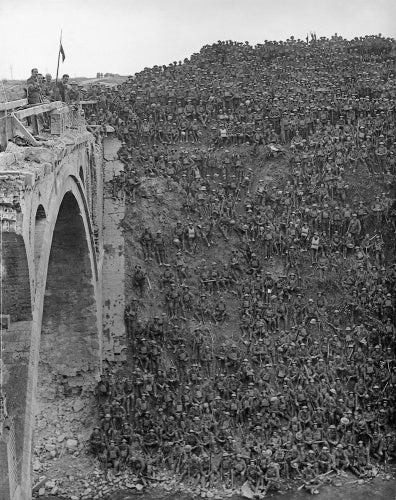 Men of 137th Brigade, 46th Division, are addressed by Brigadier General J C Campbell VC CMG DSO on the Riqueval Bridge after breaking the German's Hindenburg Line defences on 29 September 1918.