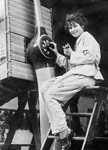 A member of the Women's Royal Air Force (WRAF) working on the propellor of an Airco DH9A in 1918.