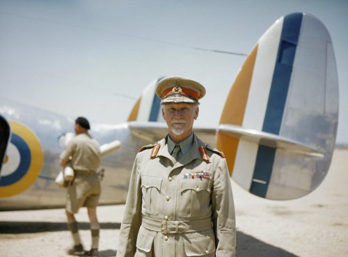 Field Marshal Jan Smuts, Prime Minister of the Union of South Africa, standing in front of a Lockheed Lodestar aircraft of No. 234 Squadron SAAF.