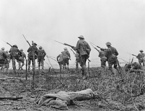 Still from the British documentary film 'The Battle of the Somme'. The image is part of a sequence purportedly showing British soldiers moving forward through wire at the start of the Battle of the Somme, 1 July 1916.