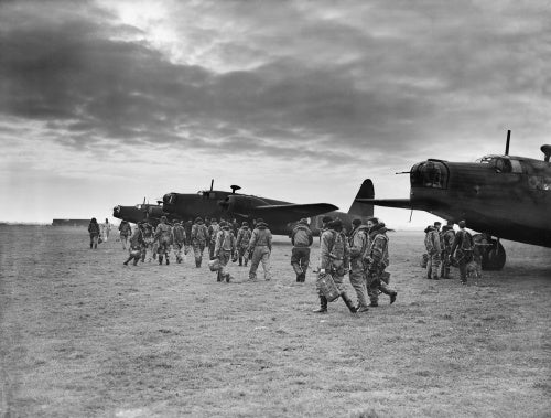 Aircrews of No. 149 Squadron RAF approach a line of Vickers Wellington Mark IAs at Mildenhall, Suffolk for an early morning training sortie.   The Squadron's operations at this time were directed mostly against German naval installations and shipping.