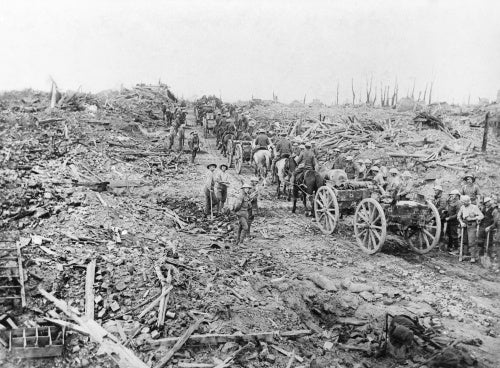 Horse-drawn ammunition limbers pass through the ruined village of Longueval, Somme, September 1916