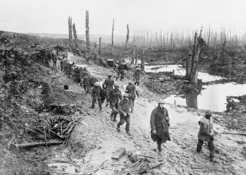 British troops of the 17th Battalion, London Regiment, 47th Division, crossing a muddy area in the Ancre Valley, Somme, October 1916.