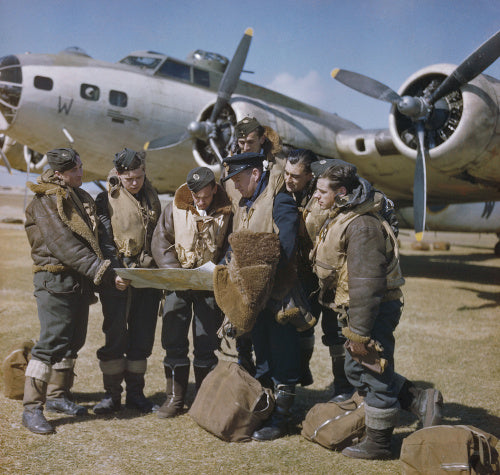 Publicity shot purporting to show the captain of a Boeing Fortress Mark II  holding a final conference with his crew before take off.