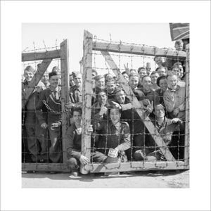 POWs at Stalag 11B at Fallingbostel in Germany welcome their liberators, 16 April 1945.