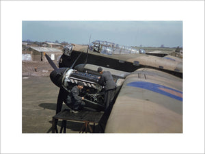 Mechanics work on the port engines of an Avro Lancaster
