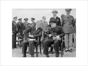 President Roosevelt and Winston Churchill seated on the quarterdeck of HMS PRINCE OF WALES for a Sunday service during the Atlantic Conference, 10 August 1941.