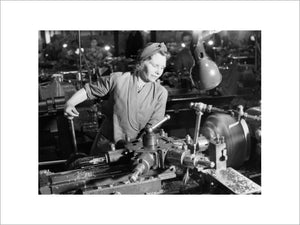 Mrs D Cheatle from Sheffield operating a capstan lathe at a munitions factory in Yorkshire during 1942.