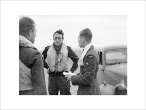Squadron Leader Brian 'Sandy' Lane, CO of No. 19 Squadron (centre) confers with Flight Lieutenant Walter 'Farmer' Lawson and Flight Sergeant George 'Grumpy' Unwin at Fowlmere near Duxford, September 1940.
