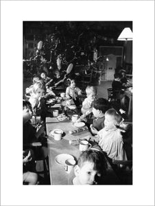 Christmas dinner for children in a home for evacuees at Henley-on-Thames, Oxfordshire, 1941.