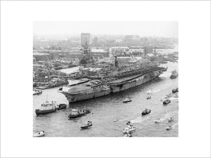 HMS HERMES about to berth at Portsmouth Harbour on her return from the Falkland Islands, 21 July 1982.