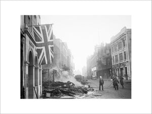 A Union Flag hangs defiantly from a building in the aftermath of the air raid which devastated the centre of Coventry on the night of 14/15 November 1940.