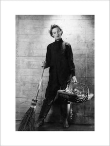 A Cecil Beaton portrait of a member of the Women's Royal Naval Service equipped for gardening duties.