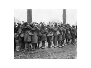 A line of British troops blinded by tear gas at an Advanced Dressing Station near Bethune, 10 April 1918.