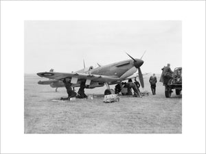 A Supermarine Spitfire Mk 1 of No. 19 Squadron RAF being re-armed between sorties at Fowlmere, near Duxford, September 1940.