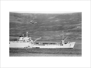 An Argentine Dagger aircraft makes a low-level attack on RFA SIR BEDIVERE in San Carlos Water in the Falkland Islands, 24 May 1982.