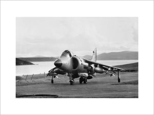 A Sea Harrier on the temporary airstrip constructed at San Carlos on the Falkland Islands, named HMS SHEATHBILL, June 1982.