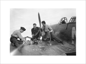 Armourers replenish the ammunition in a Hawker Hurricane Mk I of No. 310 (Czechoslovak) Squadron RAF at Duxford, Cambridgeshire, 7 September 1940.