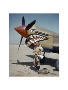 Flight Lieutenant A R Costello of No. 112 Squadron standing by his Curtiss Kittyhawk Mk I at Sidi Heneish, Egypt, April 1942.