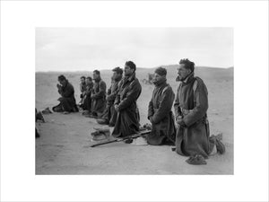 Free French soldiers attend a mass at sunrise during the siege of Bardia in Libya, December 1940.