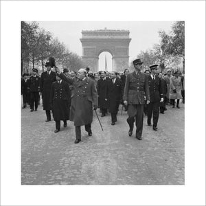 Winston Churchill and General Charles de Gaulle walk down the Avenue des Champs-Elysee duirng the French Armistice Day parade in Paris, 11 November 1944.